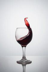 spatter of wine in a bowl in the shape of an arrow