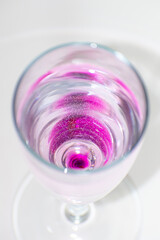 Transparent glass with pink cocktail