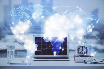 Double exposure of business theme icons and work space with computer background. Concept of success.