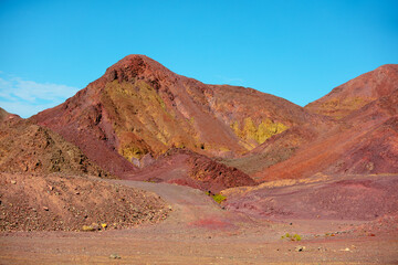 Colorful mountains. Sandstone in desert. View from car
