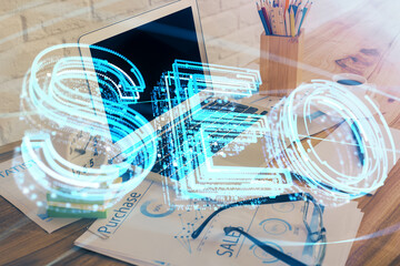 Double exposure of table with computer and seo drawing hologram. Search optimization concept.