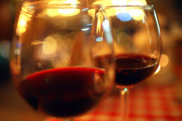 abstract aperitif alcohol glass in a restaurant interior, red wine background