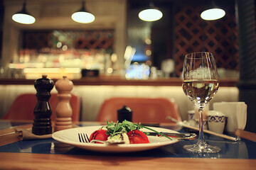 glass white wine restaurant interior, abstract evening dinner with alcohol at the bar