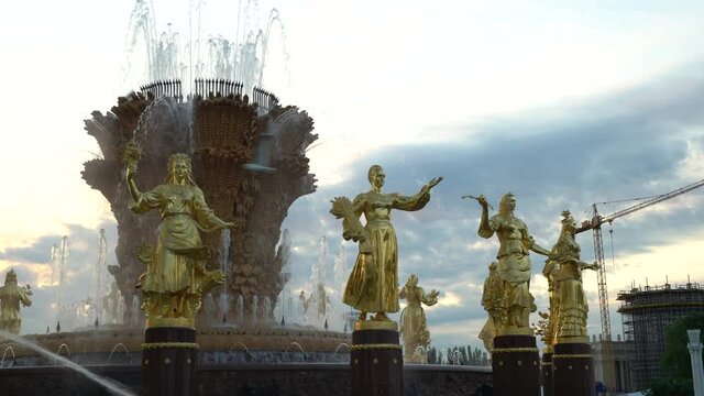 16 bronze statues fountain "Friendship of peoples" at ENEA. Dolly camera shot.