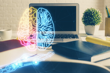Double exposure of work space with computer and human brain drawing hologram. Brainstorm concept.