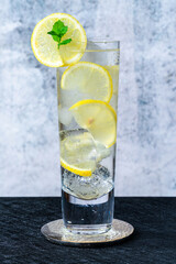 Water with lemon and ice cubes