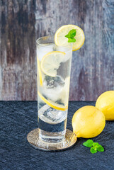 Water with lemon and ice cubes