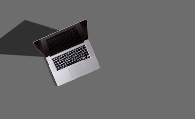 Fototapeta na wymiar Modern laptop on gray background