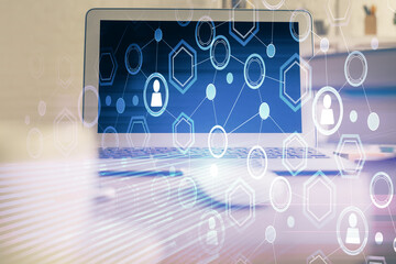 Computer on desktop with social network theme icon. Multi exposure. Concept of international connections.