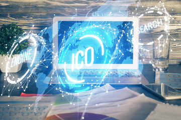 Multi exposure of blockchain theme hologram and table with computer background. Concept of bitcoin crypto currency.