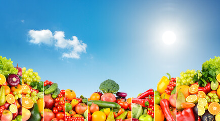 Obraz na płótnie Canvas Panoramic photo of different fruits and vegetables on background of blue sky