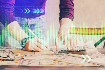 Obraz premium Multi exposure of man standing and planing investment with stock market forex chart.