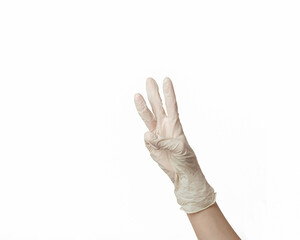 hand of a girl in a white rubber glove on a white background