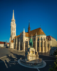 Obraz premium The Matthias Church (Church of the Assumption of the Buda Castle), is a Roman Catholic church located in Budapest, Hungary, in front of the Fisherman's Bastion at the heart of Buda's Castle District