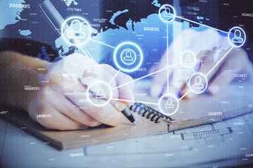 Social network theme hologram over woman's hands writing background. Concept of international people connect. Double exposure