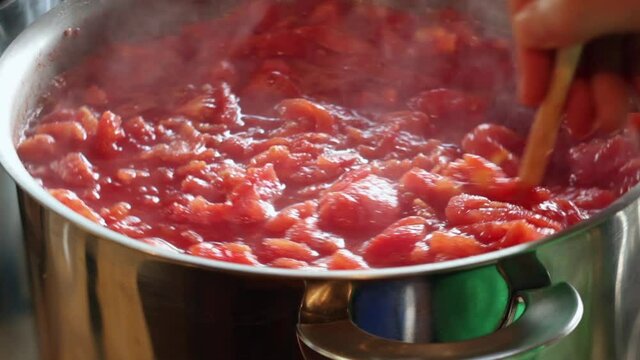 Stewing a large batch of tomatoes for canning