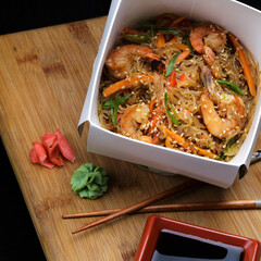 Chinese Noodle with shrimps and vegetables in box to take away.