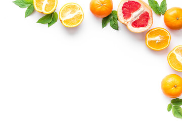 Citrus fruits frame on white background top view