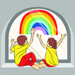 Little children on background of painting rainbow on window. Photo of kids leisure at home. Positive visual support during quarantine Pandemic at home. Family background
