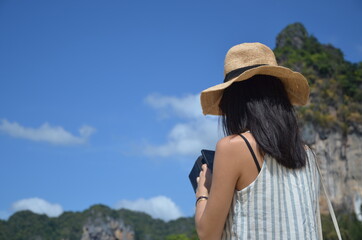 Girl enjoying outdoors in Thailand while being on vacation. Cheerful traveling.