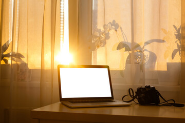 Laptop with blank screen isolated, white aluminium body.