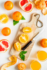 Cutting board with citrus fruits top view