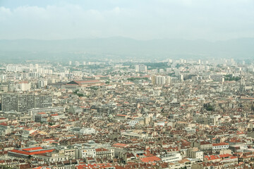Aerial view of Marseille, with a focus on Belsunce and Saint Charles, districts with a high urban density, during a polluted day. Marseille is a Mediterranean port and the second biggest French city