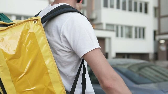 Courier delivery of food by bicycle during an outbreak of the virus. Coronavirus, COVID-19, safe delivery.