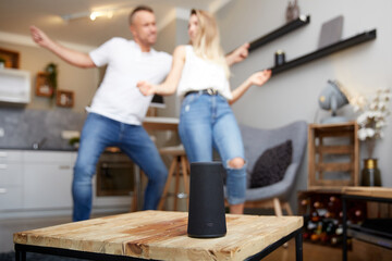 Smart Speaker Against Couple Dancing At Home