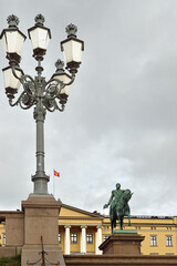 Fototapeta premium Street lantern, Equestrian statue of King Carl Johan and Royal Palace. Oslo, Norway