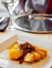 Syrup glazed citrus orange with caramelized orange peel dessert