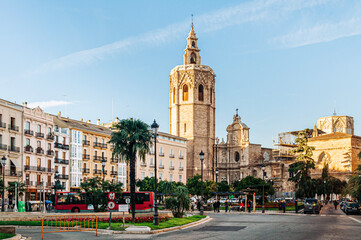 Fototapeta na wymiar Valencia Cathedral church and bell tower seen from Plaza de la Reina