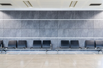 A group of seats in a clean nice decorated waiting hall at terminal, airport, mall or a hospital.