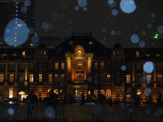 Tokyo station building in snowflakes reflection