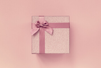 Big present box with  bow on a colorful background . Christmas or birthday gift.