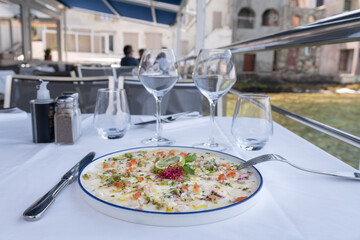 Octopus Carpaccio in a restaurant by the sea