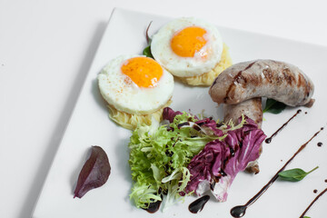 tasty and fresh fried scrambled eggs with sausages