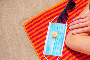 man, sunglasses, seashell and mask on the beach