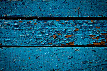 Naklejka premium Wooden planks with peeling blue paint close up