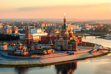 Fototapeta premium Sunrise top view to center of Yoshkar-Ola city and Kokshaga river embankment. City wakes up. Yoshkar-Ola is a capital of Mari El republic. in Russian Federation