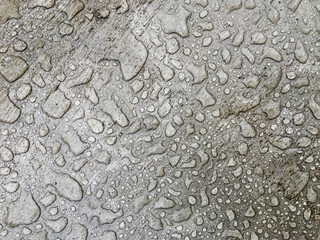 frozen raindrops on a concrete plane, for the background, gray