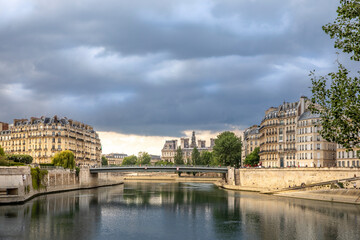 Paris, France - May 10, 2020: Panorama of bridge over the Seine river and haussmann buildings in Paris