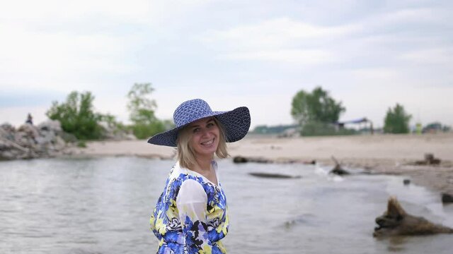 Happy Blond Beautiful Girl in hat Relaxing On Vacation Beach