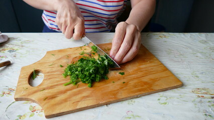 the chef cuts the greens on salad healthy food concept
