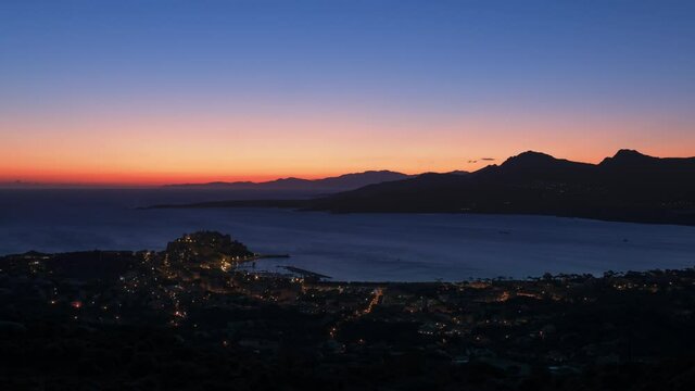 Time-lapse of dawn breaking over the Mediterranean coastline at Calvi in the Balagne region of Corsica
