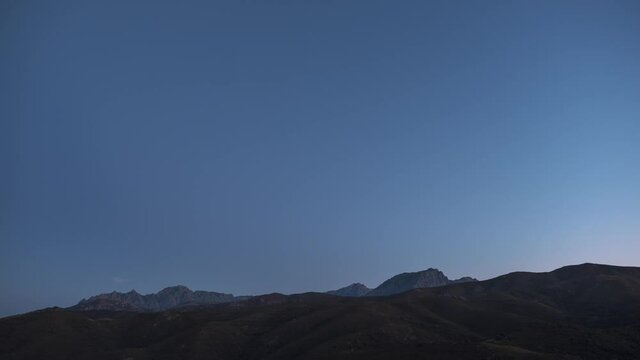 Day to night to day time-lapse of the Milky Way passing over Mont Padro and Monte San Parteo in Corsica