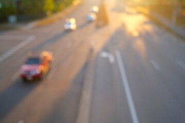 High angle view of defocused cars zooming on a road