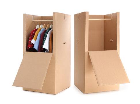 Cardboard wardrobe boxes with clothes on white background