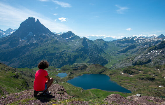 hiking woman looking Pic du Midi Ossau in french Pyrenees mountains