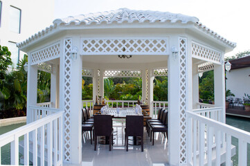 Lunch in a white gazebo at sunset